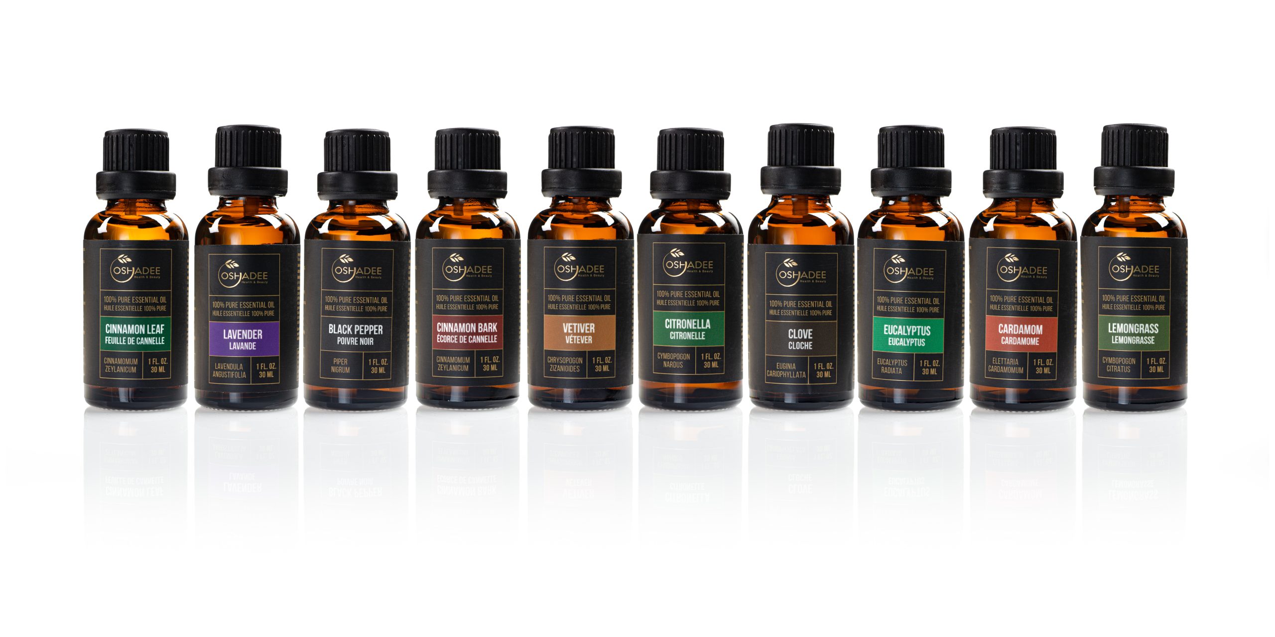 High-volume e-commerce product photography of Oshadee essential oil bottles in a lineup with reflections, shot by Jason Babakaiff in Kelowna.
